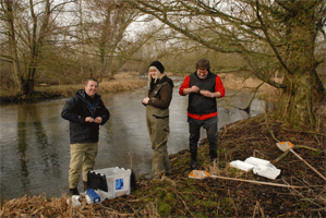 Mark Trimmer with an Agapetus-encrusted rock from the River Itchen